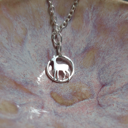 Silver necklace with a deer charm 