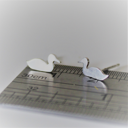 Tiny Sterling Silver Duck Earrings on ruler